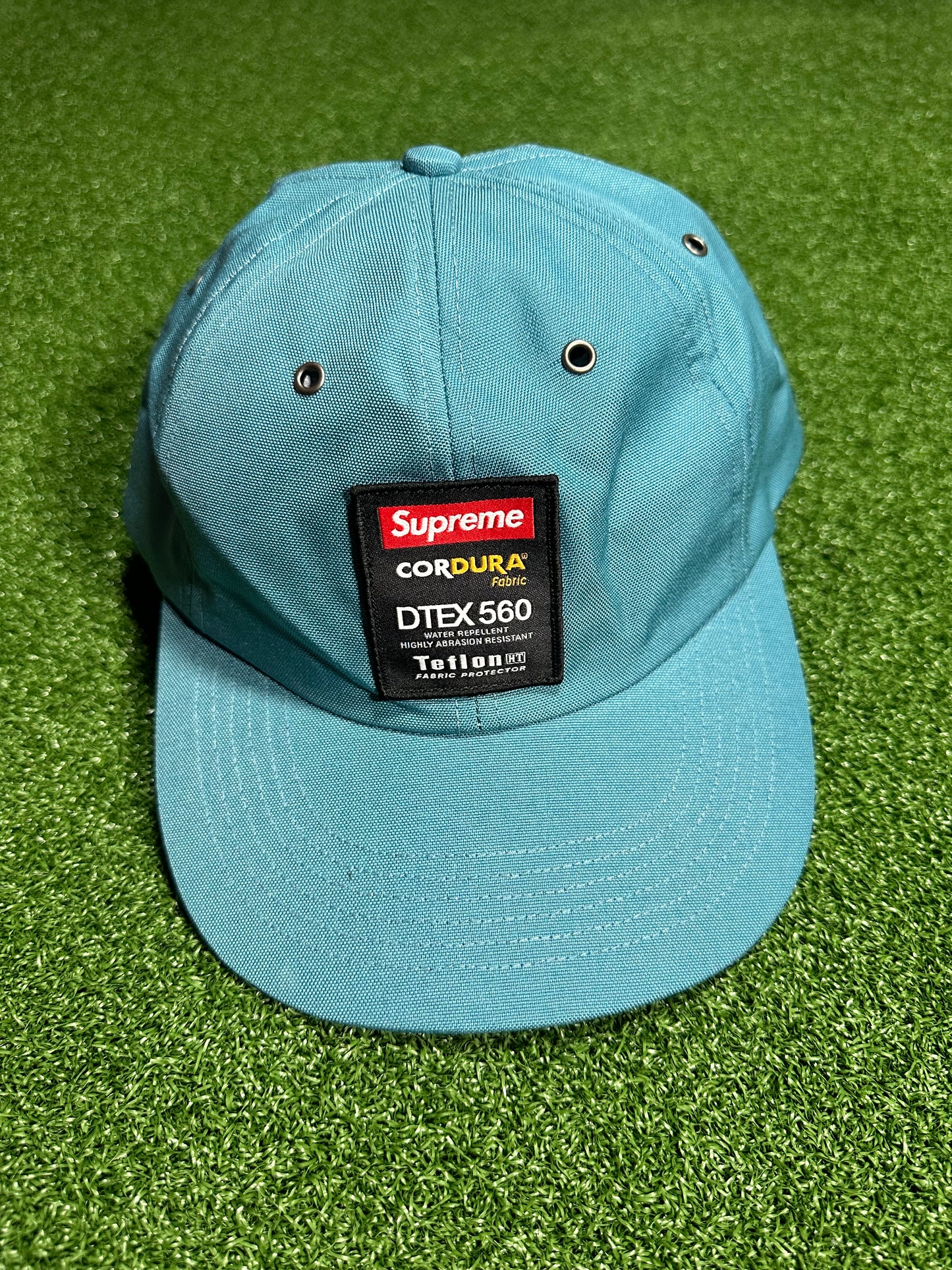 Etiqueta de teflón Supreme Cordura de 6 paneles en color verde azulado