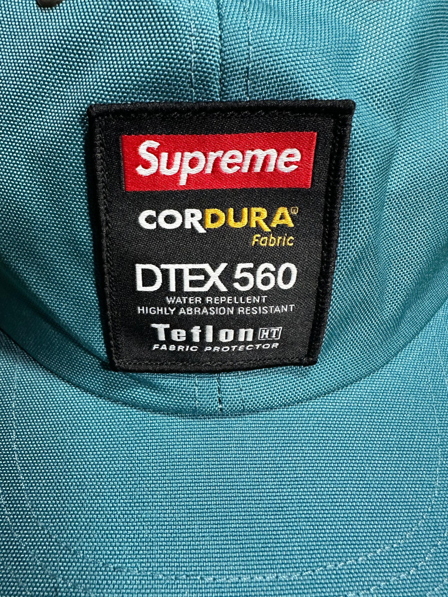 Etiqueta de teflón Supreme Cordura de 6 paneles en color verde azulado