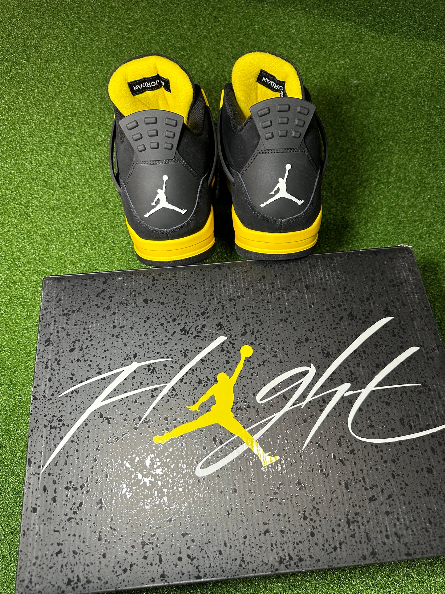 Air Jordan 4 Thunder 2023 front view – black and yellow colorway