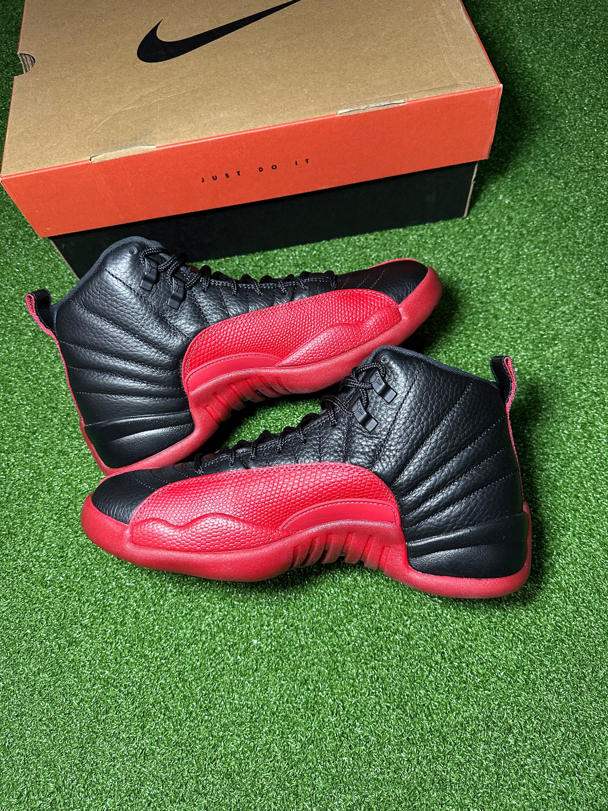 Side profile of Retro Jordan 12 Flu Game sneakers