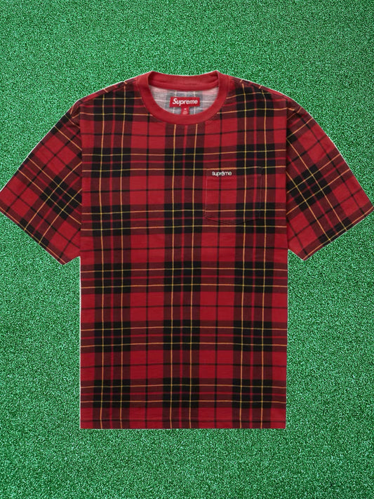 Red plaid t-shirt with Supreme logo on a green textured background